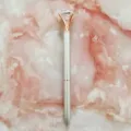 Elegant silver ballpoint pen with a large diamond-top crystal and rose gold accents - 1.0mm Bullet Tip / Silver Barrel with Rose Gold Claw