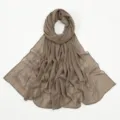 Close-up detail of the elegant chiffon hijab scarf featuring delicate bow embroidery accents. - 194*75cm / Khaki