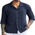 Detailed view of mens dark blue ribbed long sleeve shirt with lapel and button down style. - Navy Blue