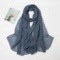 Grey blue cotton linen crinkled scarf detail flat lay, featuring frayed raw edges. - Denim Blue