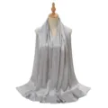 Detail view of the silver crinkle satin hijab, showcasing smooth texture and fine pleats. - Light Gray