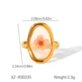 Detailed view of an oval gold stainless steel ring featuring a real dried pink flower. - One Size (Adjustable Open) / Pink Eternal Flower Style (XZ-R30235)