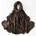 Close-up detail of the brown chiffon hijab showing exquisite chain and rhinestone edge design. - Coffee Plaid