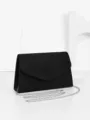 Black velvet evening clutch bag with silver chain strap, elegant minimalist design for women. - Black