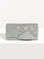 Silver pleated evening clutch bag with sparkling rhinestone bow for party events. - Silver