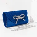 Elegant blue glitter evening clutch bag with rhinestone bow and silver chain strap. - Sapphire Blue