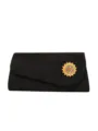 Black evening clutch bag with rhinestone sunflower brooch, elegant asymmetric flap design. - Black