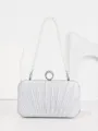 Silver pleated evening clutch bag featuring elegant pearl handle and crystal ring clasp design. - Silver