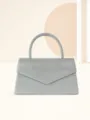 Silver glitter evening handbag with single handle and envelope flap design for women party. - Silver