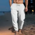 Men's casual linen pants detail shot showing elastic drawstring waist and pocket design. - S / Bottoms / White