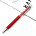 Elegant red crystal ballpoint pen with premium metallic finish for corporate gifting. - Red