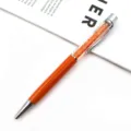 Elegant orange metal ballpoint pen featuring a transparent barrel filled with sparkling crystals - Orange