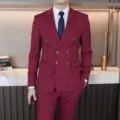 Detail shot of burgundy double breasted men suit, refined tailored fit for business formal wear. - EU Size XXS / Burgundy