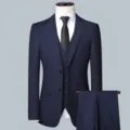 Detailed view of the classic dark blue men's three-piece business suit jacket and vest. - Navy Blue