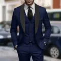 Men's slim fit three-piece suit detail, featuring a blue jacket, vest, trousers, and shirt. - Navy Blue