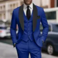 Detailed view of royal blue three-piece men suit with black shawl lapel and vest. - US Size XXS / Set / Sapphire Blue