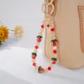 Chinesische Handy-Handschlaufe mit roten Erdbeerperlen und goldener Quaste - Rote Erdbeere Stil / Erdbeere Quaste Anhänger (Rot)