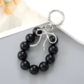 Portachiavi con perle nere e fiocco d'argento ciondolo borsa elegante - Ciondolo Fiocco a Nastro & Perline Nero (K4711)