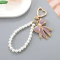 Elegante ciondolo per borsa in perle con fiocco di strass viola e gancio a cuore - Ciondolo con Fiocco Viola / Viola (K4943)
