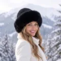 Elegant black winter knit hat with thick faux fur trim for women in snowy mountain scenery - One Size / Vertical Stripe Mongolian Hat / Black
