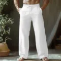 Detailed view of casual white linen pants with drawstring waist and deep side pockets. - S / White