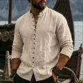 Detail view of men's casual long sleeve linen shirt with mandarin collar and dual pockets. - S / Khaki
