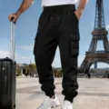 Men's black cargo sweatpants detail view, showing elastic drawstring waist and side pockets. - S / Black