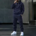 Mens navy blue hooded tracksuit with lace-up collar and cargo pockets, perfect for casual wear. - Navy Blue