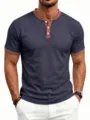 Men's waffle knit short sleeve polo shirt detail showing collar and button placket design. - Navy Blue