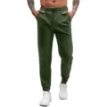 Detailed view of the dark green waffle knit sweatpants featuring an adjustable drawstring waist. - S / Bottoms / Dark Green