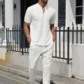 Detailed view of white waffle knit short sleeve zip polo shirt and casual pants set. - S / Top And Bottom / White