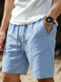Men casual linen shorts detail view showing soft fabric texture and elastic waistband. - Light Blue