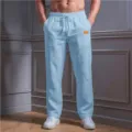 Detail shot of light blue men's casual trousers featuring comfortable drawstring waist and side pockets. - Light Blue