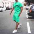 Detailed view of the vibrant green summer casual short sleeve t-shirt and shorts set. - Lake Blue