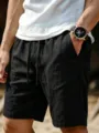 Men's casual linen shorts detail view, breathable summer beach wear with elastic drawstring waist. - S / Black