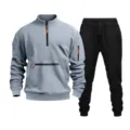 Detail view of the casual men's half-zip sweatshirt and black sweatpants tracksuit set. - Light Gray