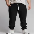 Men casual black drawstring jogger pants detail shot, comfortable breathable everyday fabric design. - S / Bottoms / Black