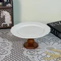 European style white ceramic cake stand with relief pattern and wooden base for home decor display. - Square Floral Pedestal Trays / 8 Inch