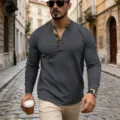 Detailed view of men waffle knit long sleeve henley shirt with contrast collar and buttons. - S / Tops / Dark Gray
