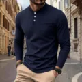 Details view of a men's navy blue waffle knit long sleeve henley shirt with chest pocket. - S / Navy Blue