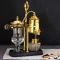 Luxury balance siphon coffee maker set with golden metal stand and glass brewing pot. - Gold