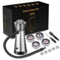 Detail view of portable cocktail smoke infuser kit with wood chips, filters, and accessories. - Silver