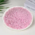 Natural crushed rose quartz crystal gravel stones in a white plate for aromatherapy decor - Treated Pink Quartz / 3-5mm (100g)
