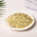 Natural yellow citrine crystal chips displayed on a white ceramic plate for decor - 3-5mm/500g / Lemon Yellow Quartz