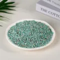 Natural teal green crystal crushed stone chips presented in a white ceramic dish - Amazonite / 3-5mm (100g)