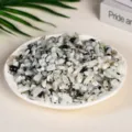Natural tumbled white and grey moonstone crystal chips displayed in a white dish - Black and White Moonstone / 5-7mm (100g)