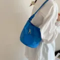 Bolso cubo de ante azul con correa de hombro anudada y monedero redondo para mujer. - Azul