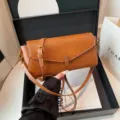 Stylish brown leather shoulder bag, trendy women casual crossbody bag with adjustable metal strap. - Caramel color