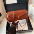 Elegant brown leather shoulder bag for women, stylish crossbody handbag with metal lock and strap. - Brown