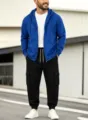 Men's casual royal blue zip hoodie and black cargo joggers set outdoors modern view. - Blue